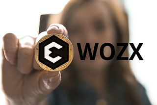 Women holding a WOZX token.