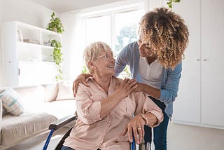 elderly woman enjoys companionship with home health aide