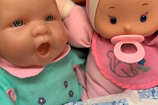 Two baby dolls.