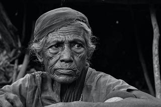 Grayscale potrait of an elderly woman.