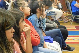 Latina students learning about the Digital Divide