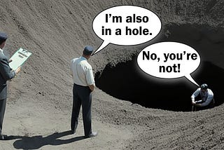 A man is sat in a hole in the ground, while another man looks down at him from outside the hole. A third man is watching them both whilst holding a clipboard that reads “empathy test”. The man outside the hole is saying, “I’m also in a hole,” to which the man in the hole replies, “no, you’re not!”