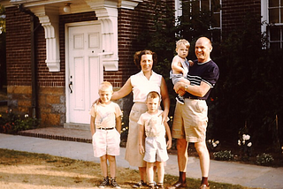 Picture of generic family from 1950s, husband, wife and three kids
