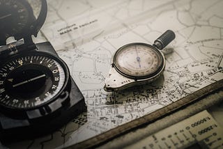 Photo of a map and compass.