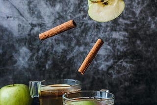 sliced apples in a glass with cinnamon