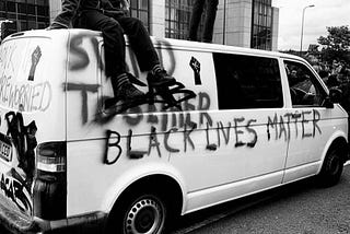 Protestors on top of a van sprayed with the words ‘Black Lives Matter’ London march, London June 2020