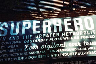 Store front banner with the word SUPERHERO on it