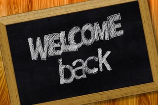 a chalk board that says welcome back