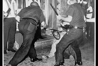 A black man being beaten by police