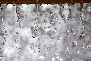 Water trickling through sand.