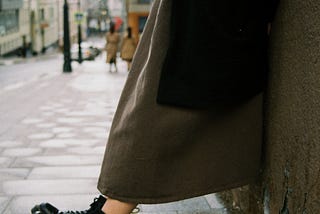 The legs of a young woman wearing chunky Doc Marten style boots