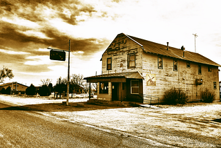 Image of an old diner near a railroad yard.