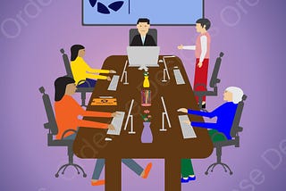 A group of five people sit around the table in a business meeting.