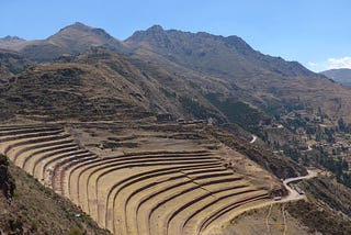 Terraces in the mountains and a winding road.