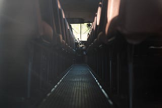 Staring down the aisle of a school bus