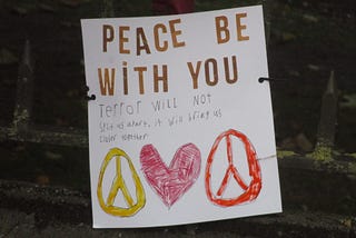 “Peace be with you” poster at Christchurch mosque shooting memorial, Thursday 21 March 2019