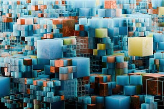 Abstract imagery of cubes in various colors (blue, orange, and yellow) stacked in abstract shapes.
