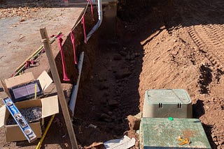 hole dug to set a foundation for an addition