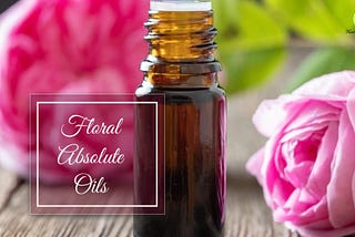 A Botlle of Floral Absolute oil with some flowers