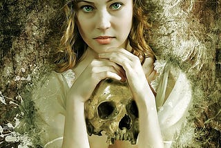 Young woman with auburn hair, holds a skull between her hands