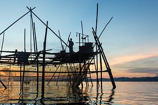 Silhouette of the traditional fishing structure built with bamboo called Bagang, typical of Sabah, Borneo.