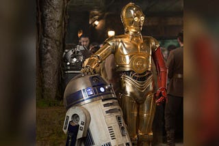 An image of R2-D2 and C3PO standing next to each other, an image still taken from the movie Star Wars.