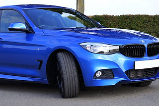 a blue car parked outside