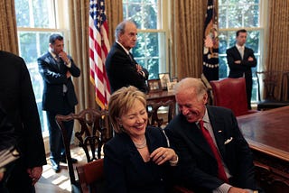 Hillary Clinton and Joe Biden sharing a laugh in the Oval Office during the Obama administration.