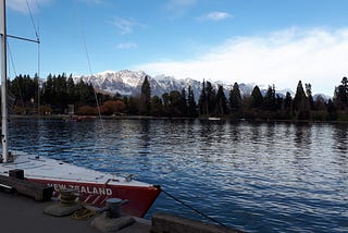 Image by author: scenery of a lake with trees and snowy mountains in the background.