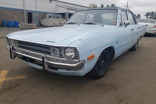 This is a picture of a four-door, baby blue 1970 Dodge Dart sedan like the one owned by my Uncle Joe. The photo is from Kars4Kids: https://kars4kidsgarage.com/1972-dodge-dart-blue/