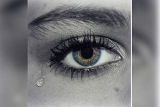 An image of an eye with tears dropping from it to show how hurt some writers are by medium partner program.