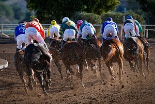 Horses racing.