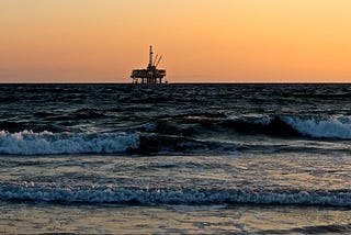 Drilling platform at sunset.