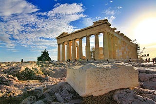 Photo of the Parthenon ruins on a mostly sunny day