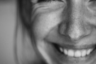 A close up of a woman smiling