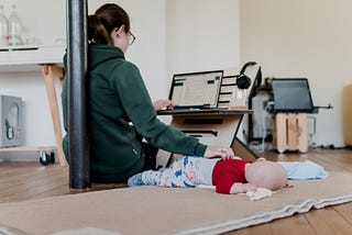 Mother working from home — with baby