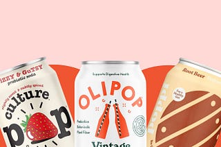 A can of culture pop strawberry, Olipop vintage cola, and poppi root beer