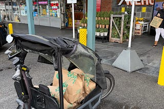 Picking up groceries on a bicycle