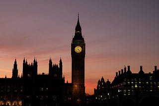 A shot of the Elizabeth Tower, known as Big Ben, and the Houses of Parliament, at dusk.