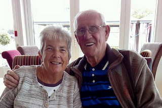 A photo of Kirsty’s nan and grandad embracing and smiling.