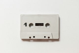 A blank, white cassette, symbolic of a clean slate, a fresh start