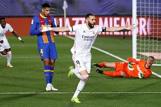 Real Madrid wins the La Liga title by defeating FC Barcelona.