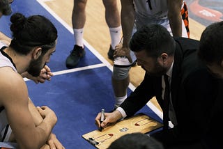 Basketball coach draws strategy for team, but not like an agile coach would