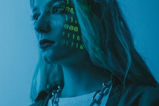 Women standing with boolean code projected on her face