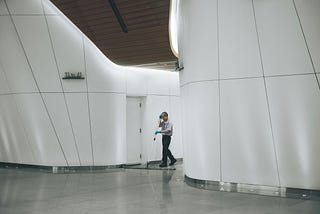 a man sweeping a corridor. a creative in action