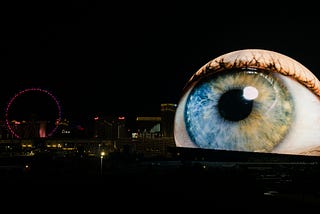 A shot showing The Sphere in the Las Vegas skyline, with the external LED screens depicting an eyeball