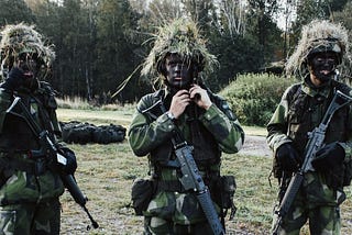 An image of three soldiers at a training bootcamp, intended to be a play on words with coding bootcamp.