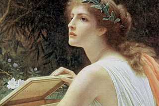 A woman wearing an ivy crown looks off to her left while opening a golden box