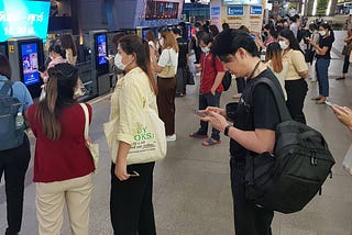 People lining up for the Bangkok Skytrain