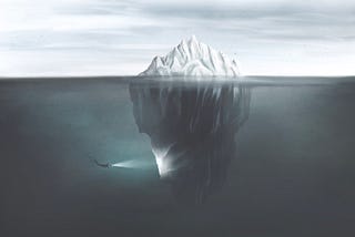 Image showing the cross-section of an iceberg, and a diver exploring the large section underwater.